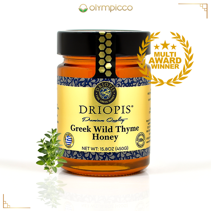 Jar of Driopis Greek Wild Thyme Honey with a decorative label and award emblem on a white background.