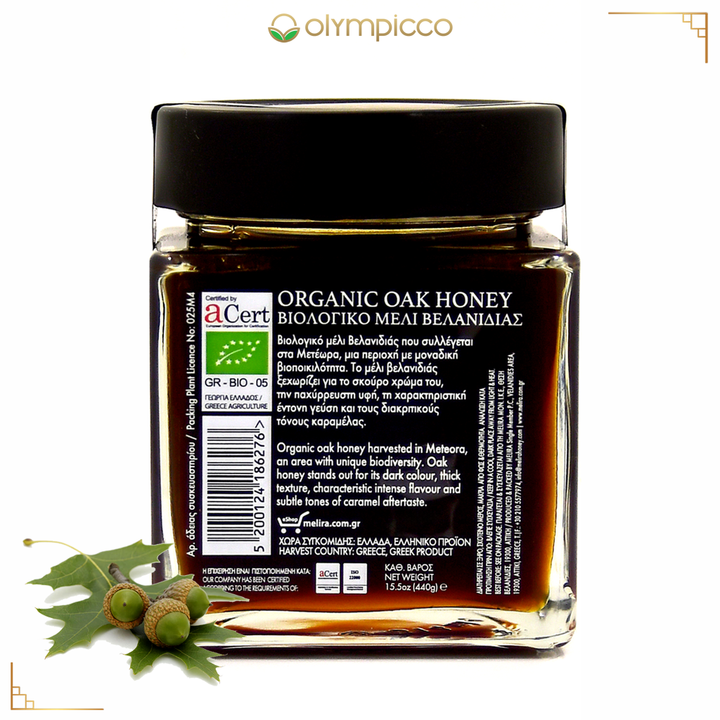 Jar of organic oak honey with a visible label on a white background