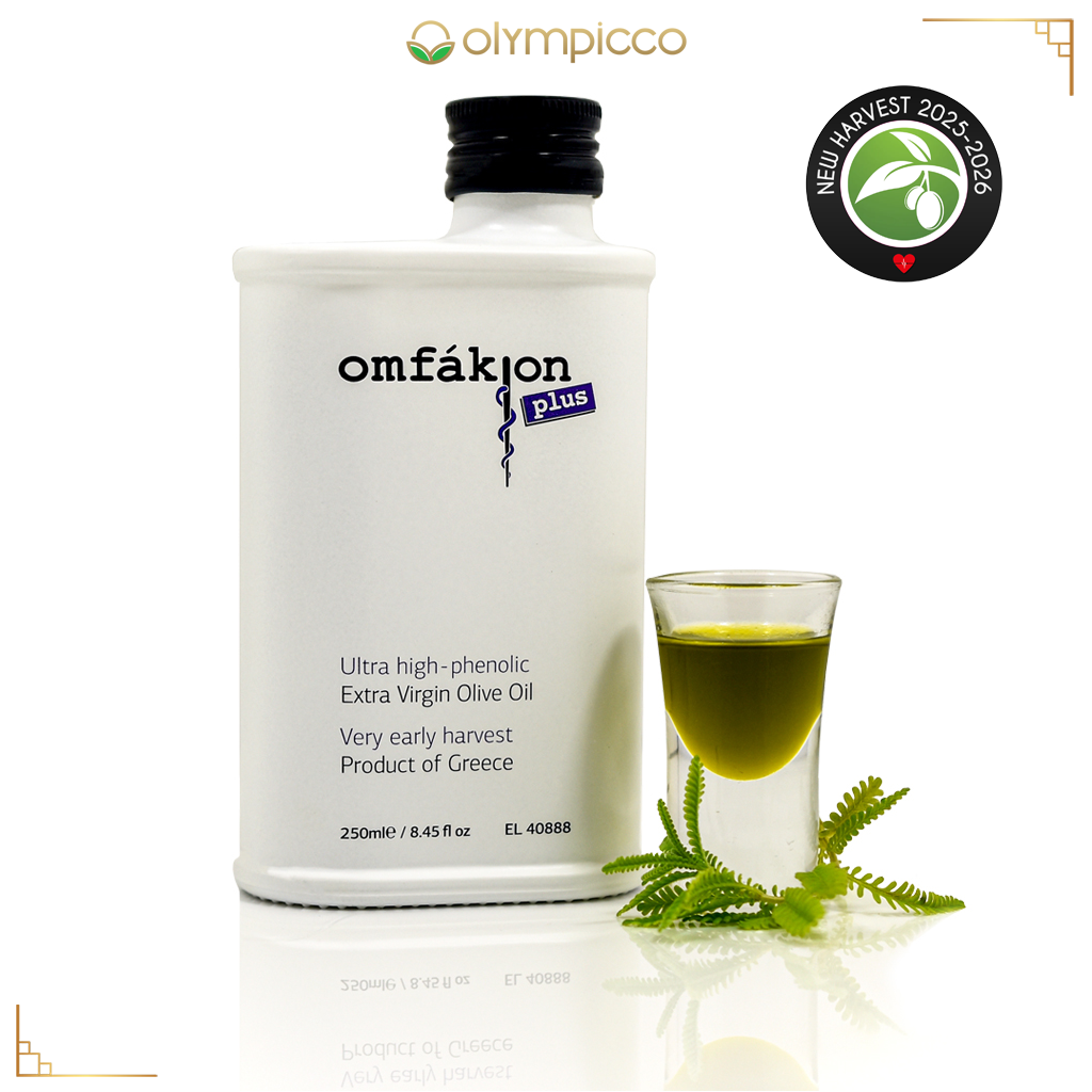 Omfakion Plus Olive oil bottle with a glass of olive oil and green leaves on a white background, featuring the brand 'omfákion'.
